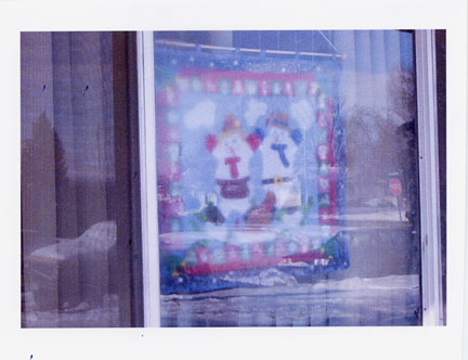 [snow-man-in-window.jpg]