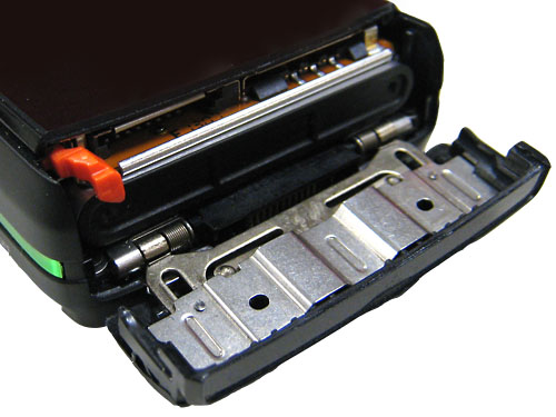 Sony Ericsson K850i - slide-out door that allows access to the battery and the SIM card.