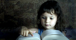 [young-girl-reading-from-a-big-book-~-u16397153.jpg]