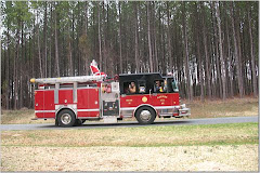 Santa rides on a firetruck!