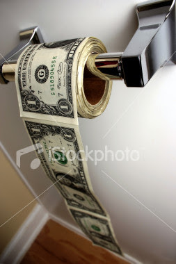 ist2_378740_money_down_the_toilet.jpg