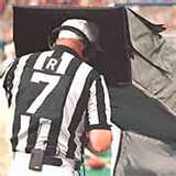 [NFL+referee+looking+under+hood.jpg]