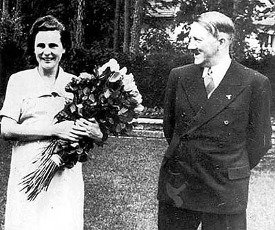 [German+actress+film+maker+Leni+Riefenstahl+holds+a+bouquet+of+roses+as+Nazi+leader+Adolf+Hitler+looks+at+her+and+smiles+in+1937.jpg]