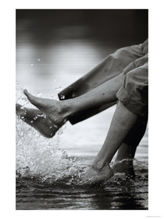 [Couple-Splashing-Water-withFeet-Photographic-Print-C12139204.jpeg]
