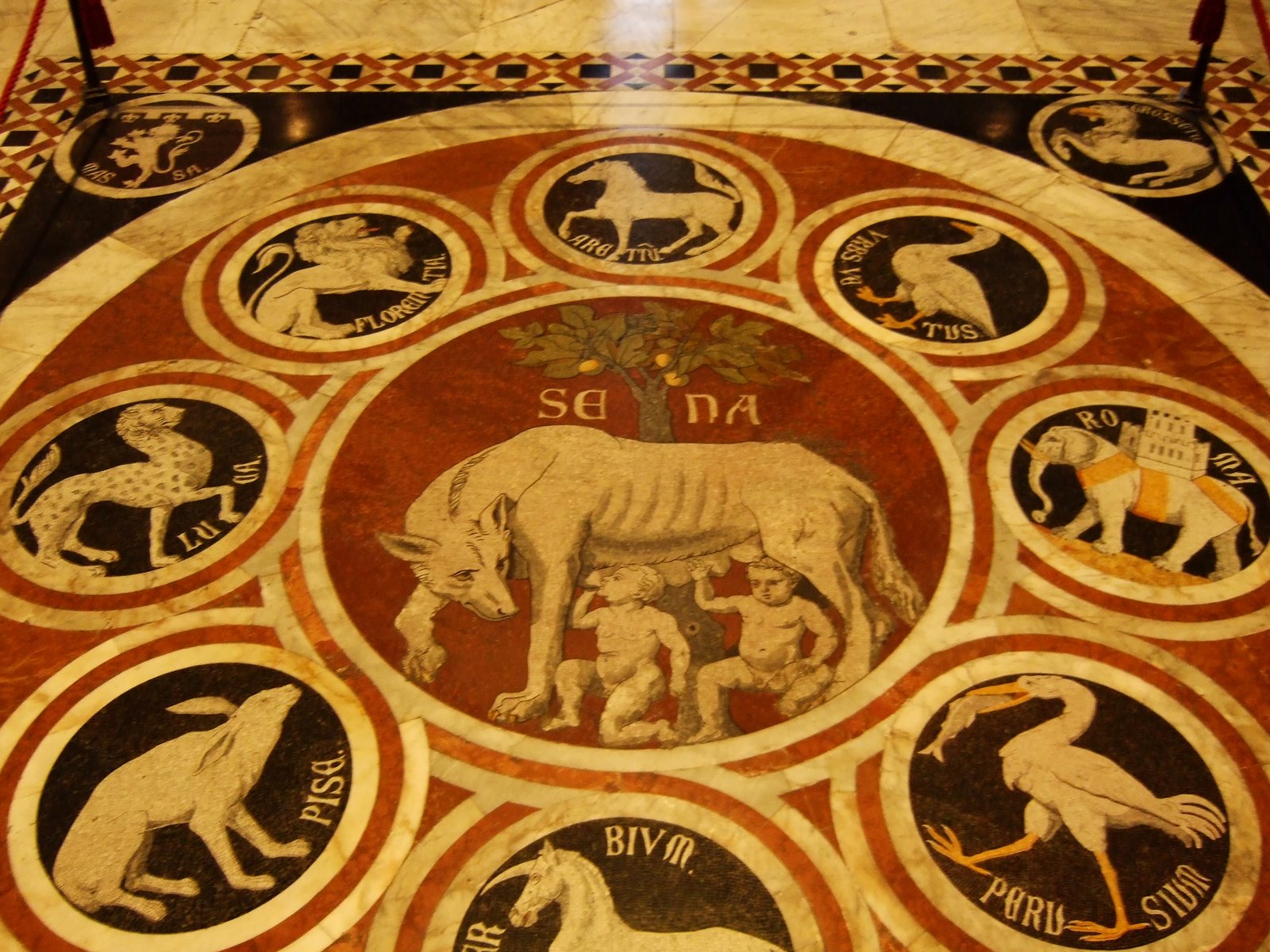 [Siena--Duomo+mosaic+she-wolf.JPG]