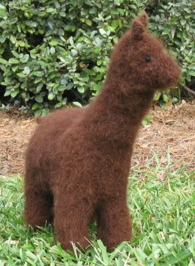 Handspun, handknitted, handfulled toy alpaca in alpaca fiber.
