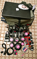 a bag with camera lenses and lenses