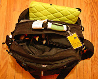 a bag with a yellow tag and a green bag