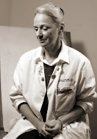 a woman in a white coat