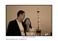 a man and woman looking at the eiffel tower