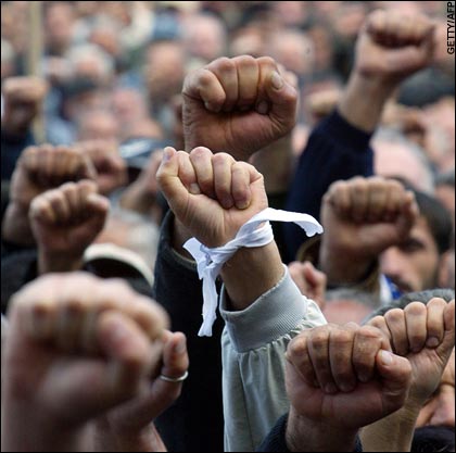 [Georgia's+opposition+supporters+raise+their+fists+during+a+rally+in+Tbilisi.jpg]