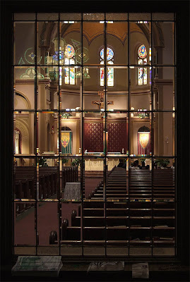 Saint Charles Borromeo Roman Catholic Church, in Saint Charles, Missouri, USA - nave through window in the narthex