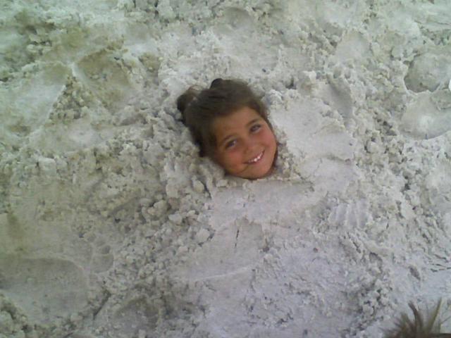 [ella+buried+in+sand.jpg]