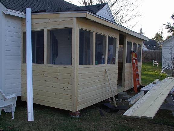 [siding+done,+roof+going+on.JPG]