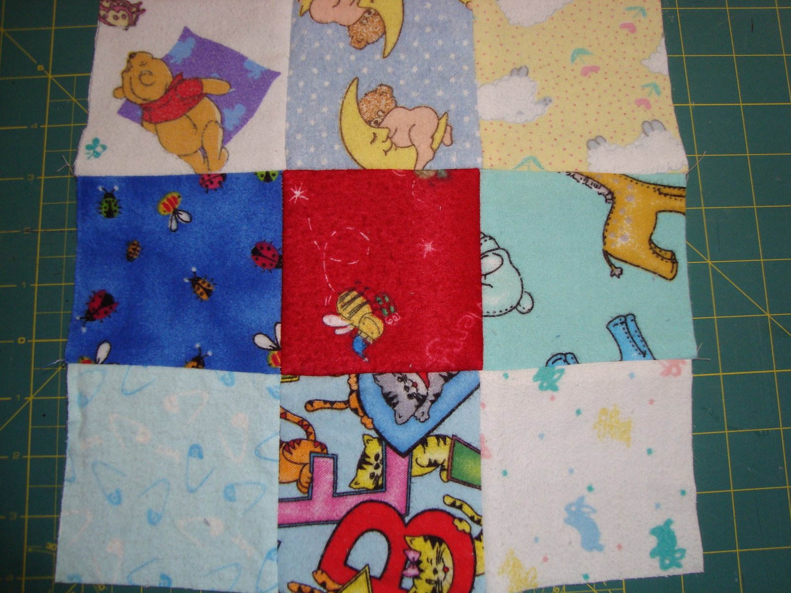 [baby+quilt+squares+sewn.JPG]