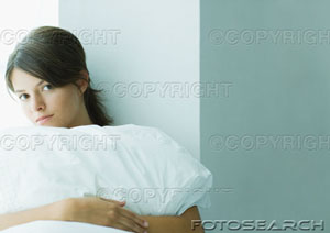 [young-woman-holding-pillow-~-paa292000039.jpg]