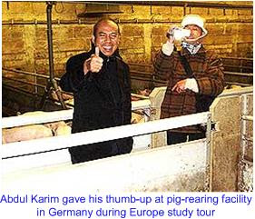 Abdul Karim thumb up on pig farm