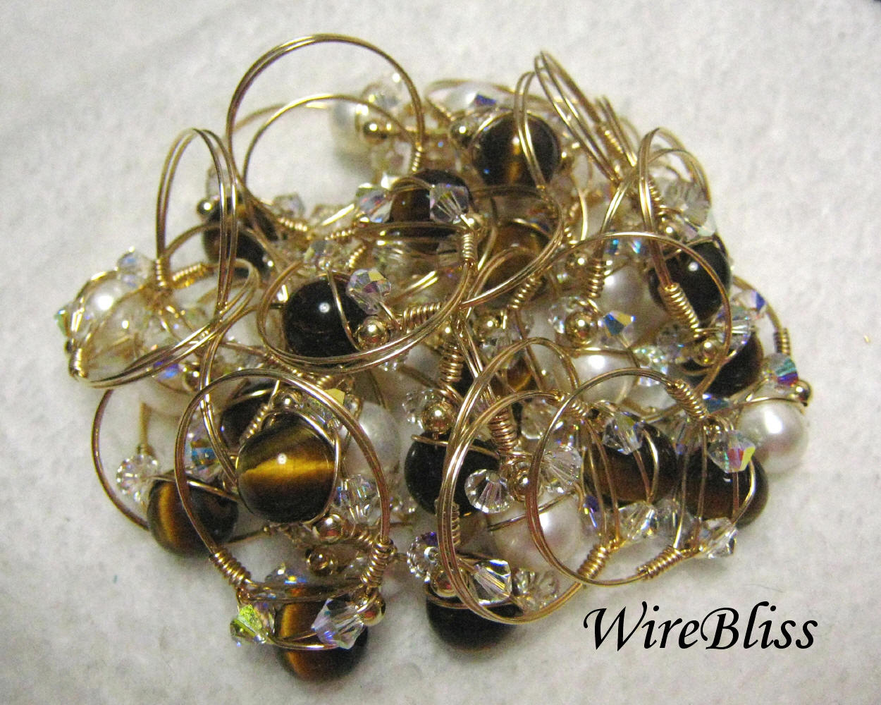 Wire wrapped sparkly crystal rings with tiger eye