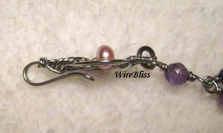 side view of the Wire wrapped Pipa Clasp with pearl