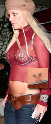 Britney Spears star and cross tattoo