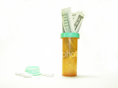 [ist2_296163_100_dollar_bill_in_drug_bottle_series.jpg]