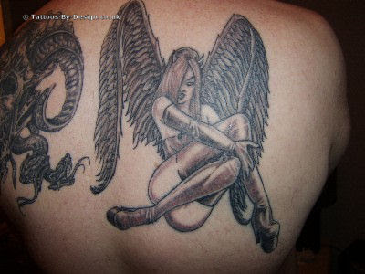 with religious tattoos such as the rosary, praying hands and crucifix.