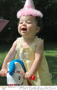 [little-girl-african-american-wearing-birthday-hat-happy-playing-on-~-brooke_clar87493.jpg]