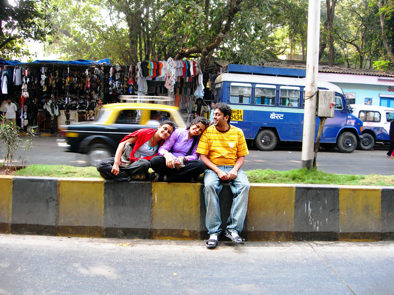 sitting on the road divider in churchgate mumbai