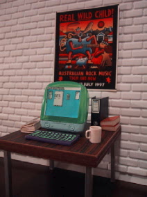 Modern dolls' house miniature office scene with iMac G3 computer.