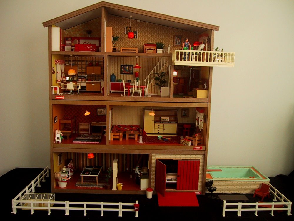 Vintage mid-1970s Lundby dolls' house with two floor extensions, pool and fence.