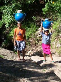 [49+-+Carmen+and+Jaquelyn+carrying+water+from+springsS.jpg]