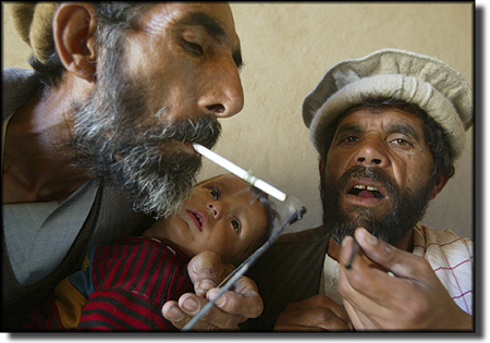 [Afghanistan_Drug+addicts+smoke+pure+opium+paste+while+one+holds+a+baby+in+Kapisa+Province,+about+100+miles+north+of+Kabul,+where+many+farmers+are+growing+opium-producing+poppy+plants.jpg]