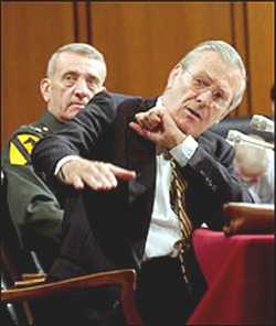 [Rumsfeld+defending+with+fists.jpg]