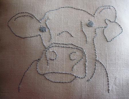 [cow+embroidery+pillow+close+up.JPG]