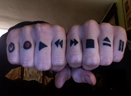 [knuckle-tattoo-with-musical-icons_49.jpg]
