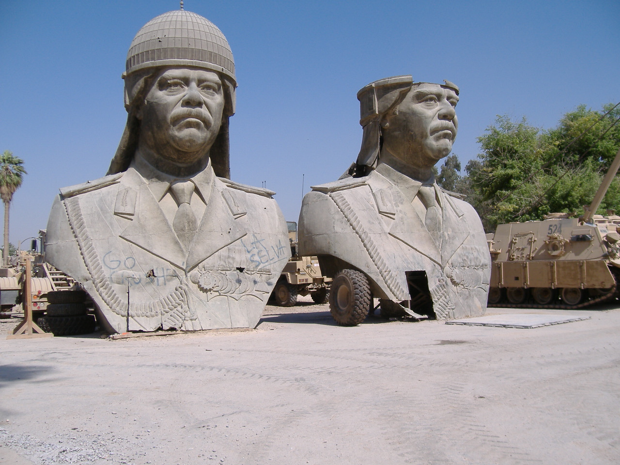 [Saddam+Statues.JPG]