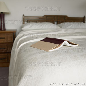 [open-book-on-corner-of-double-bed-~-200381279-001.jpg]