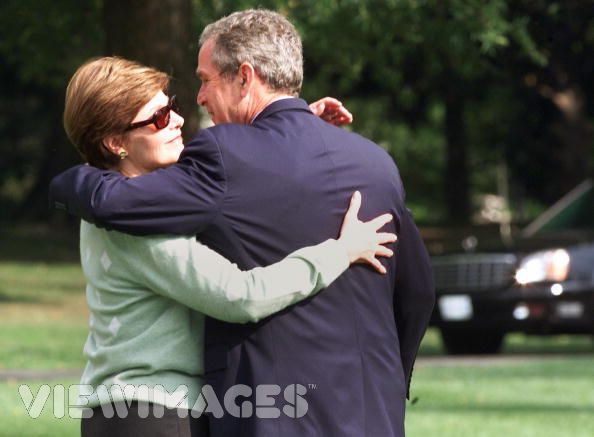 George and Laura Bush spend their free time in a huggable bliss in this candid moment