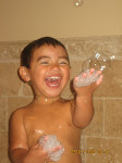 5-08Ayden Laughing catching bubbles