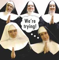 Five nuns praying, one with thought balloon that says We're trying!