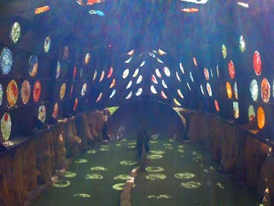 Inside the ship, the light filters through the colored plastic making patterns on the fairway