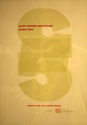 Large 5s overlapping, and smaller type that reads Happy Wooden Anniversary, 2004, Hamilton Wood Type Museum