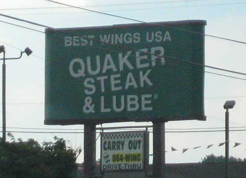 Green sign reading Quaker Steak and Lube