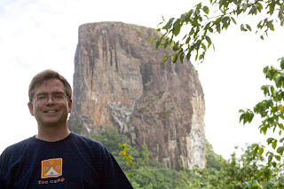 Jim with large rock mountain behind him