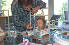 Grandpa helping E-Beth with her Cake