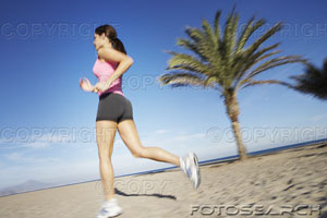 [woman-jogging-on-a-beach-~-pe0000944.jpg]