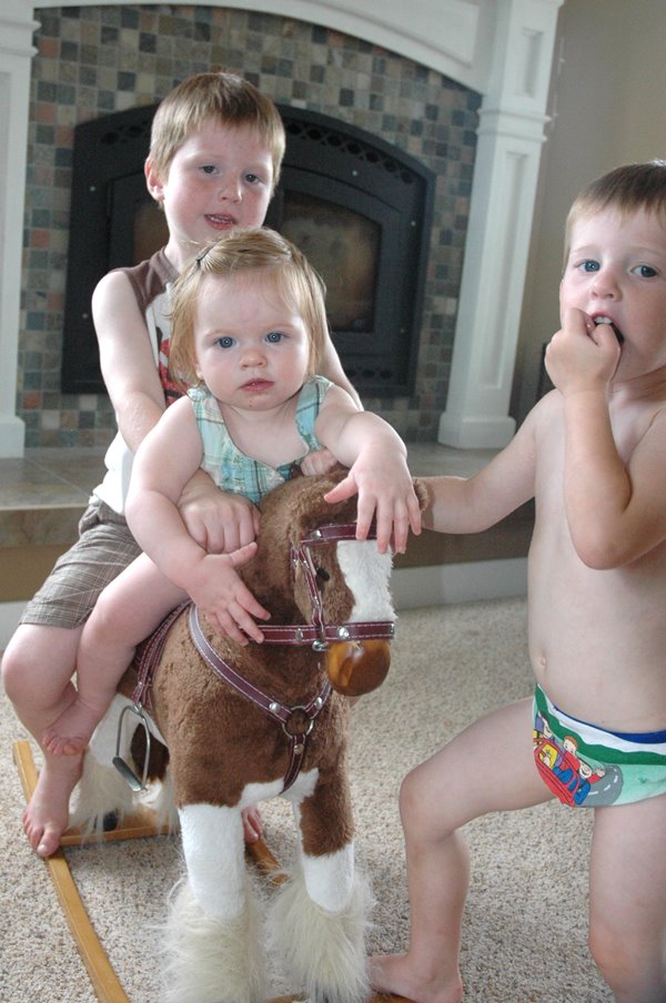 [kids+by+rocking+horse.jpg]