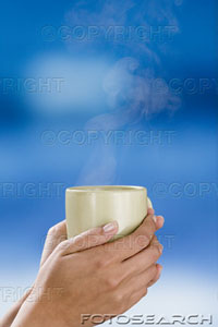 [woman-holding-steaming-mug-~-ks124067.jpg]