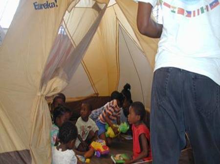 [Children+of+“Amis+de+Orphans+International”+with+new+educational+toys+in+our+play+tent.jpg]