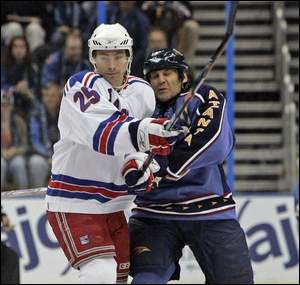 Petr Prucha, left, and the Rangers held off Scott Mellanby and the Thrashers